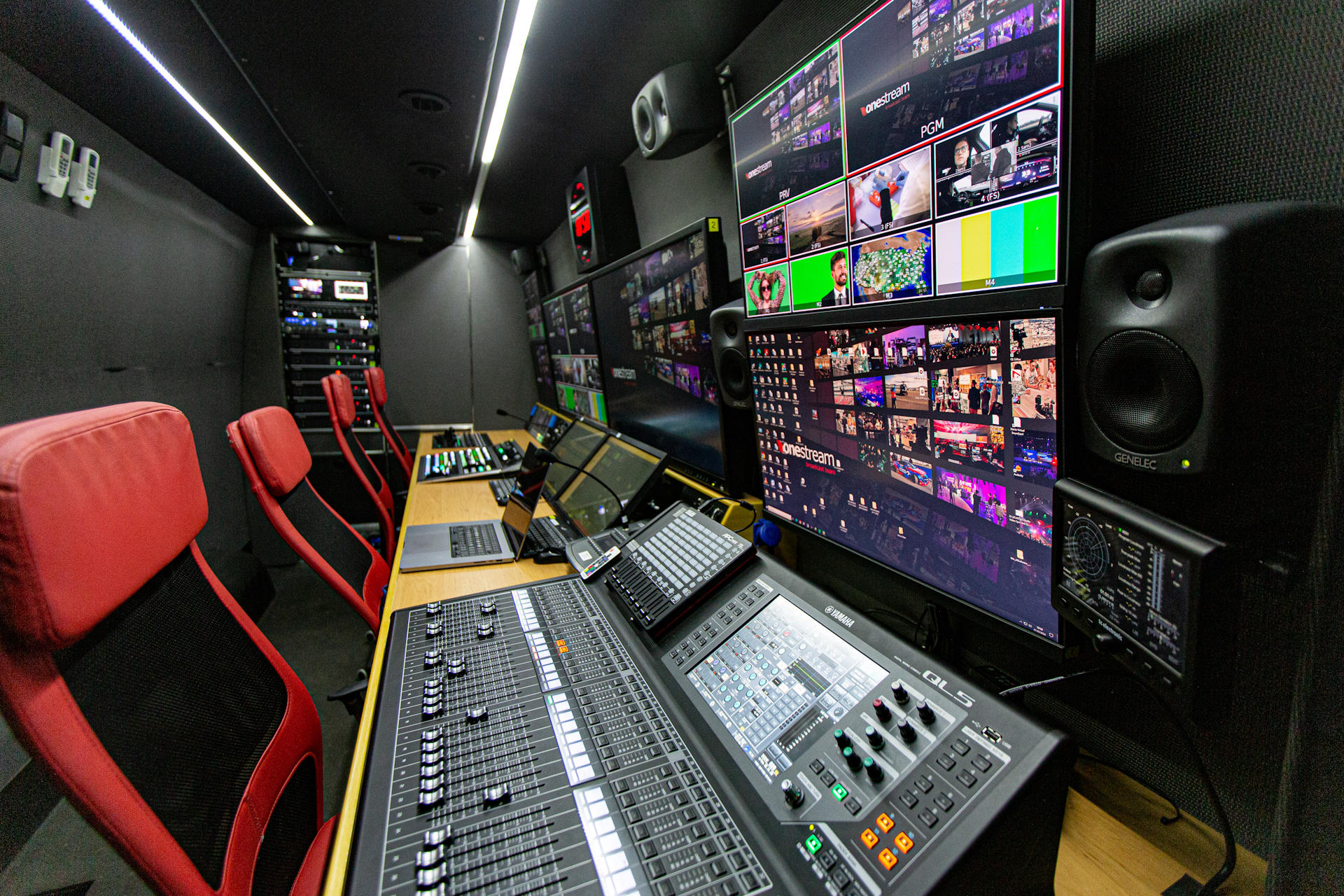UNIT10 UHD production area with audio console, monitors and red operator chairs